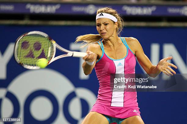 Maria Kirilenko of Russia plays a forehand in her match against Samantha Stosur of Australia during the day three of the Toray Pan Pacific Open at...