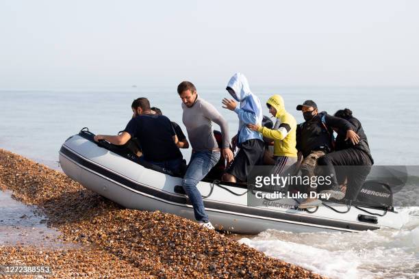 Migrants land on Deal beach after crossing the English channel from France in a dinghy on September 14, 2020 in Deal, England. More than 1,468...