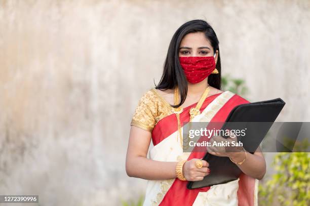 portrait of young asian/ indian businesswoman in sari - businesswoman mask stock pictures, royalty-free photos & images