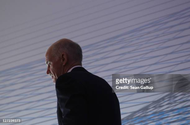 Greek Prime Minister George Papandreou prepares to speak at a convention of the Federation of German Industry to appeal for more German investment in...