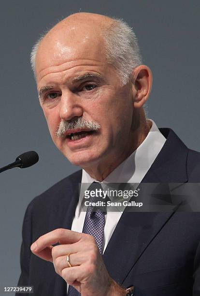 Greek Prime Minister George Papandreou speaks at a convention of the Federation of German Industry to appeal for more German investment in Greece on...
