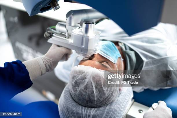 patient on an eye surgery - cataract surgery stock pictures, royalty-free photos & images