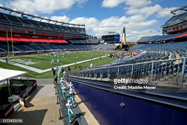 The Miami Dolphins take the field before their game against the New England Patriots at Gillette Stadium on September 13, 2020 in Foxborough,...
