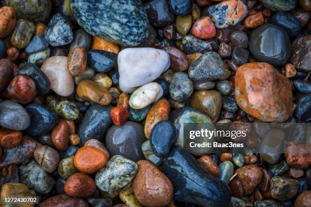 colorful rocks on a beach - minirock stock pictures, royalty-free photos & images