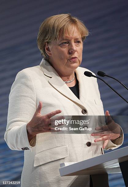 German Chancellor Angela Merkel speaks at a convention of the Federation of German Industry , where Greek Prime Minister George Papandreou spoke in...