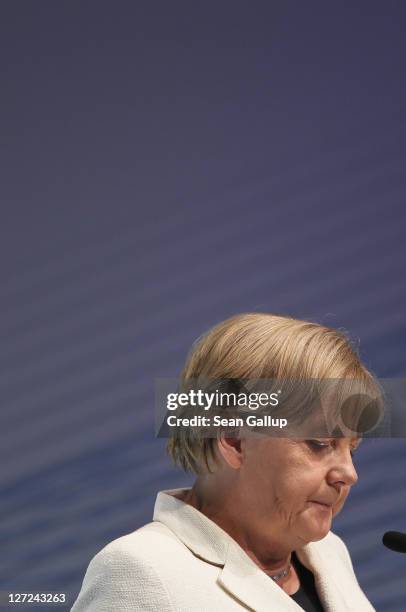 German Chancellor Angela Merkel speaks at a convention of the Federation of German Industry , where Greek Prime Minister George Papandreou spoke in...