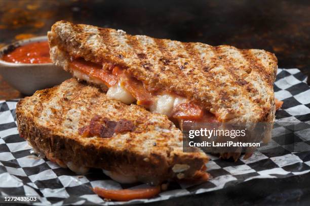 cheesy pepperoni pizza panini - panini stock pictures, royalty-free photos & images