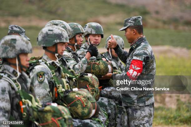 Soldiers attend parachute jumping drill on September 11, 2020 in Tibet Autonomous Region of China.