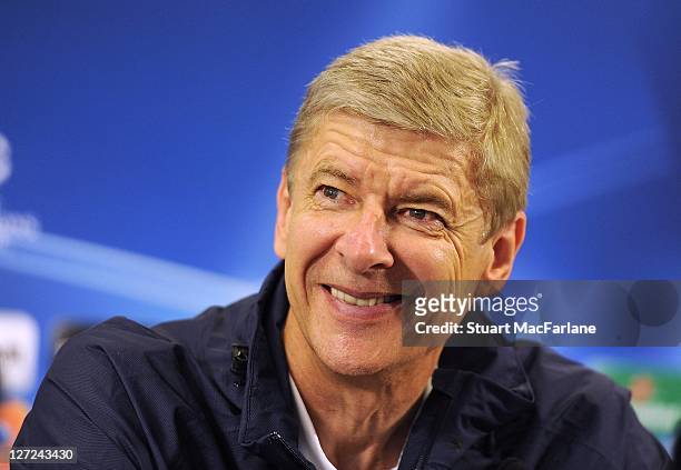 Manager Arsene Wenger attends a press conference ahead of their UEFA Champions League Group stage match against Olympiacos FC at London Colney on...