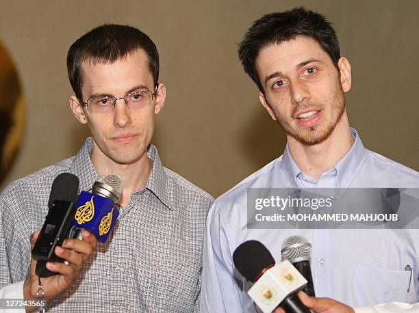 American hikers Shane Bauer and Josh Fattal hold a press conference after stepping off an Omani Royal Air Force plane on September 21, 2011 in...