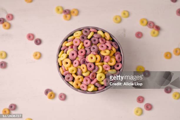 colorful cereal rings in bowl - cereales stock pictures, royalty-free photos & images