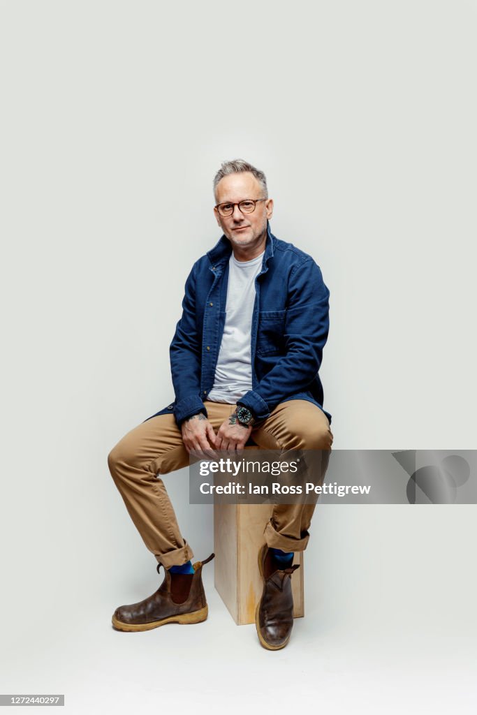 Middle-aged hipster Man wearing blue jacket