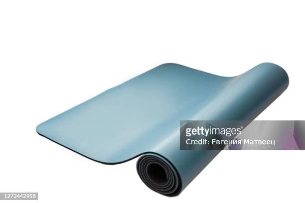 yoga fitness mat blue turquoise color isolated on white background concept. close up. copy space - yoga rug photos et images de collection