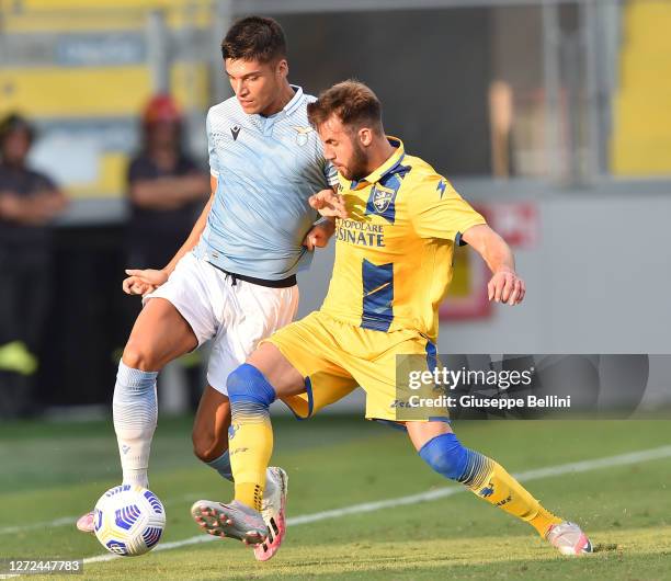Joaquin Correa of SS Lazio and Przemyslaw Szyminski of Frosinone Calcio in action during the Pre-Season friendly match between Frosinone Calcio and...