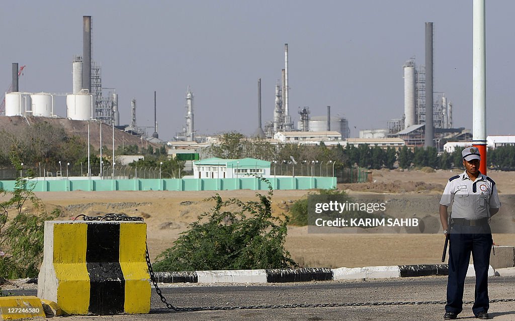 A security guard keeps watch outside an