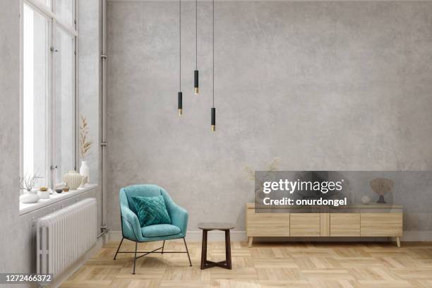 blue armchair near the window with  decorative objects. - blue room stock pictures, royalty-free photos & images