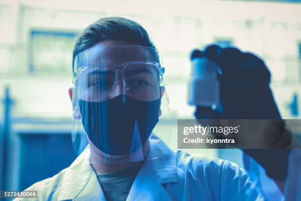 vaccine development doing tests inside of a laboratory - new discovery stock pictures, royalty-free photos & images
