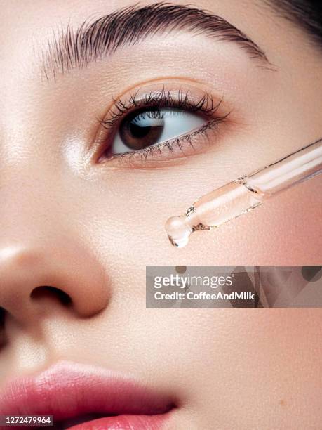 close-up portrait of beautiful girl getting skin anti aging treatment - body care and beauty stock pictures, royalty-free photos & images