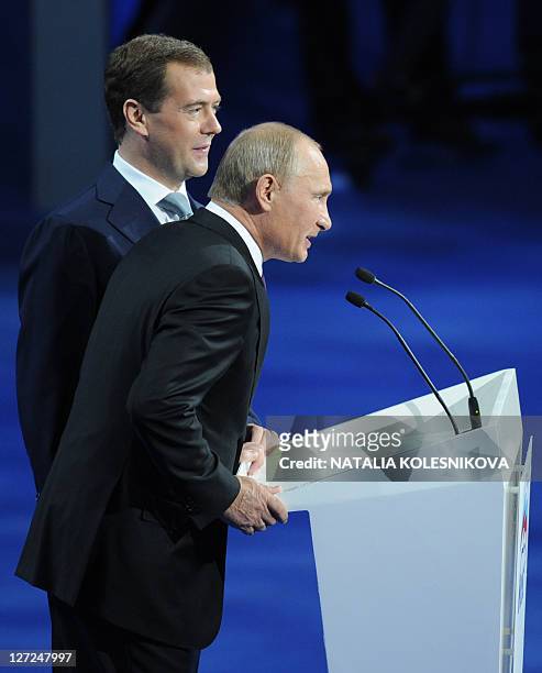 Russia's President Dmitry Medvedev and Prime Minister Vladimir Putin make a joint appearance at a congress of the United Russia ruling party in...