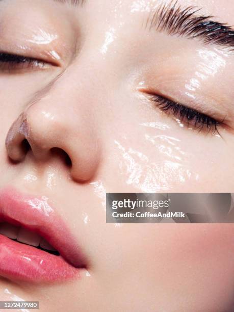 beautiful young woman with moisturizing gel on her face - skin stock pictures, royalty-free photos & images