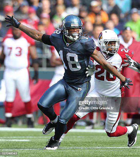 Wide receiver Sidney Rice of the Seattle Seahawks runs a pass route against A.J. Jefferson the Arizona Cardinals at CenturyLink Field on September...