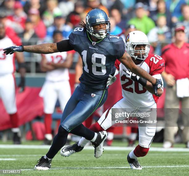 Wide receiver Sidney Rice of the Seattle Seahawks runs a pass route against A.J. Jefferson the Arizona Cardinals at CenturyLink Field on September...