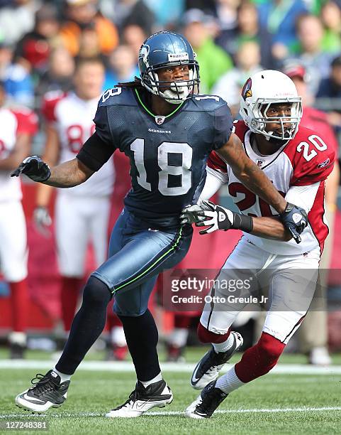 Wide receiver Sidney Rice of the Seattle Seahawks runs a pass route against A.J. Jefferson the Arizona Cardinals at CenturyLink Field on September...