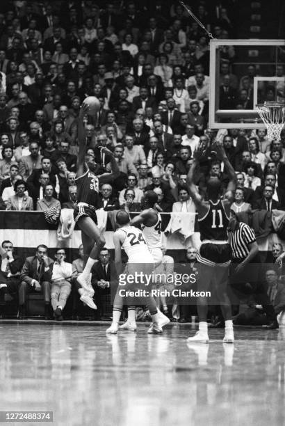 Willie Murrell of the Kansas State Wildcats shoots the ball over Dave Stallworth of the Wichita State Shockers in the NCAA Regional Final on March...