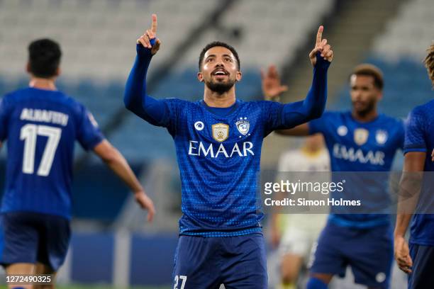 Hattan Bahebri of Al Hilal celebrates his stoppage time winner during the AFC Champions League match between Al Hilal SFC and Pakhtakor at Al Janoub...