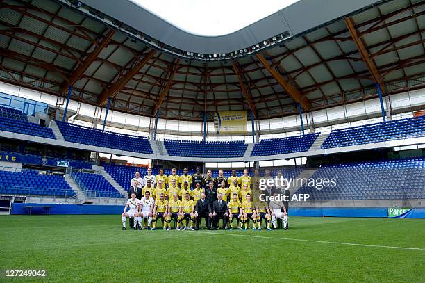 Sochaux football team's players and officials pose during a family picture on September 27, 2011 in Montbeliard. Cedric Blomme , Stephane Gilli ,...