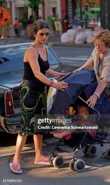 Catherine Zeta-Jones, wife of Michael Douglas, out for a stroll with son, Dylan and nanny on Columbus Avenue near their home in NYC on June 25, 2001...