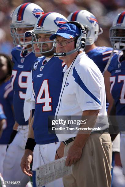 Head coach Chan Gailey and Ryan Fitzpatrick of the Buffalo Bills look on from the sidelines during NFL game action against the New England Patriots...