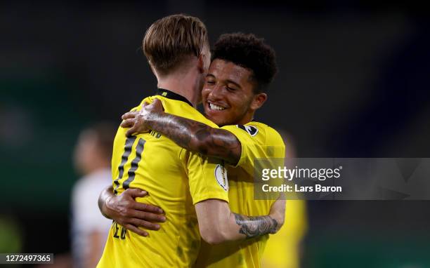 Marco Reus of Dortmund celebrates with Jadon Sancho during the DFB Cup first round match between MSV Duisburg and Borussia Dortmund at...