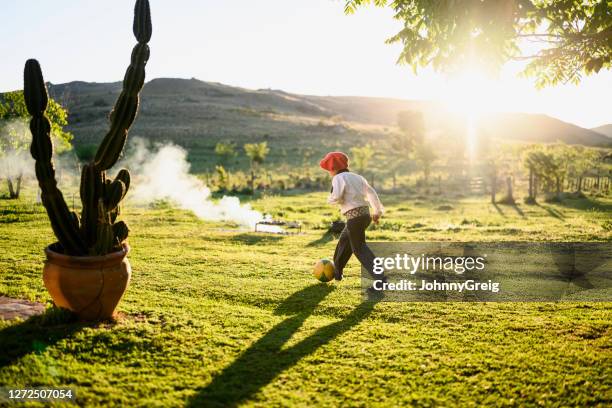 young gaucho footballer playing outdoors - gaucho ball stock pictures, royalty-free photos & images