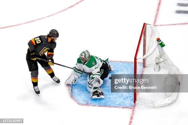 Chandler Stephenson of the Vegas Golden Knights scores a goal past Anton Khudobin of the Dallas Stars during the first period in Game Five of the...