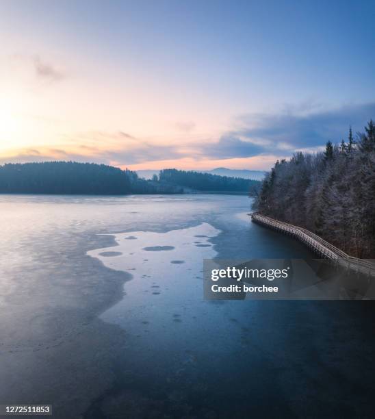 path by the frozen lake - sunrise over water stock pictures, royalty-free photos & images