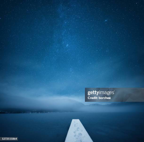 night at the frozen lake - winter sky stock pictures, royalty-free photos & images