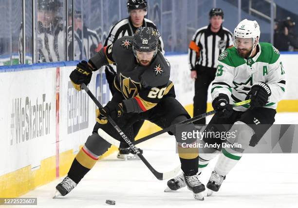 Chandler Stephenson of the Vegas Golden Knights looks the play the puck as Blake Comeau of the Dallas Stars lifts Stephenson's stick in the third...