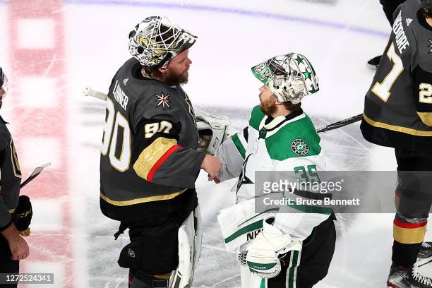 Robin Lehner of the Vegas Golden Knights and Anton Khudobin of the Dallas Stars shakes hands following the Stars 3-2 overtime victory in Game Five of...