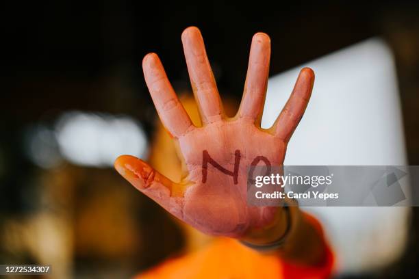 open palm showing no word written on it - youth violence stock pictures, royalty-free photos & images