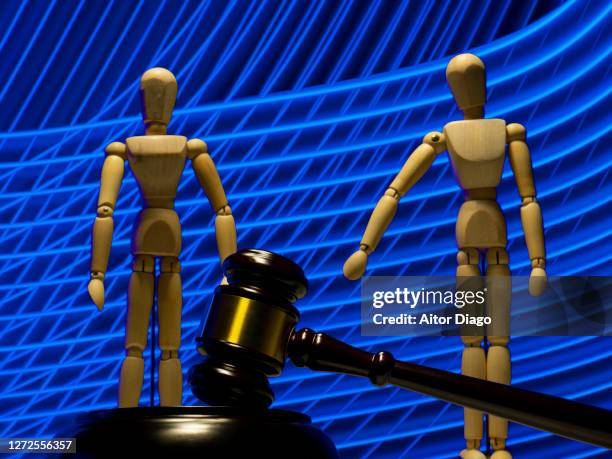 wooden judge gavel and two mannequins / couple in a modern blue setting - legal separation stock pictures, royalty-free photos & images