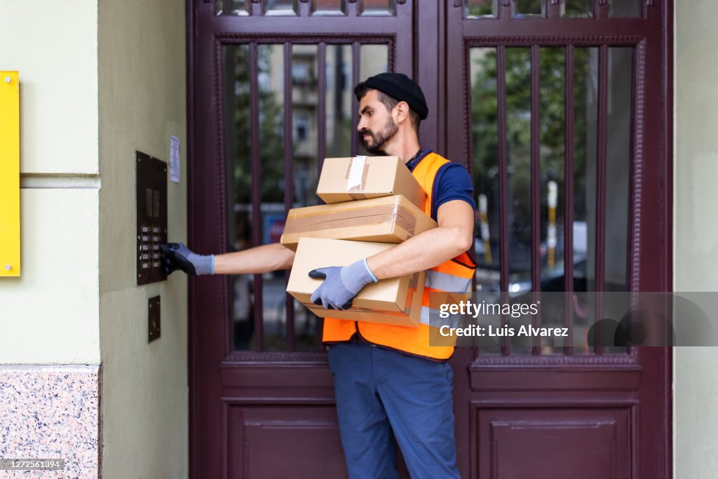 Delivery man doing home delivery of online order