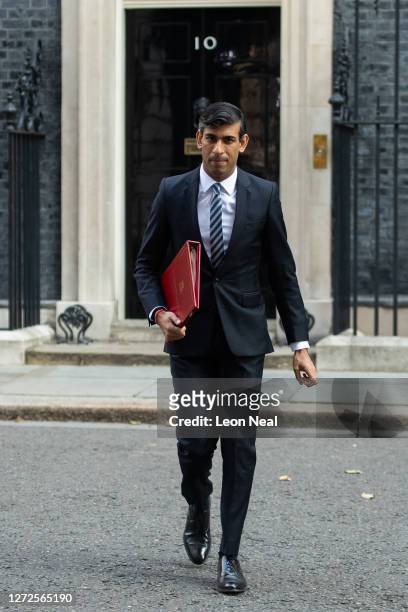 British Chancellor of the Exchequer Rishi Sunak walks from Downing Street towards the weekly Cabinet meeting at the Foreign & Commonwealth Office on...