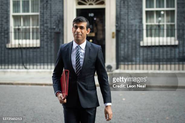 British Chancellor of the Exchequer Rishi Sunak walks from Downing Street towards the weekly Cabinet meeting at the Foreign & Commonwealth Office on...