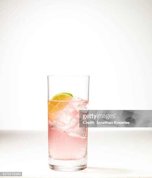 ice cold, pink lime drink - pink drink stock pictures, royalty-free photos & images