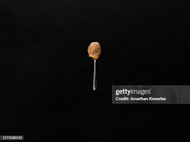 spoon of espresso ice cream - ice cream scoop stock pictures, royalty-free photos & images