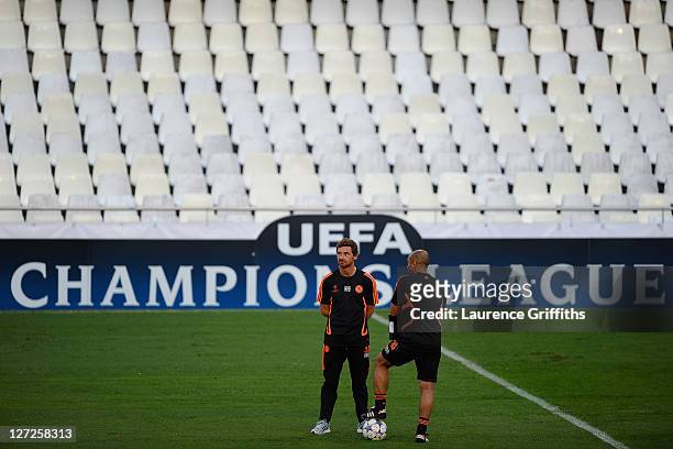Chelsea manager Andre Villas Boas and assistant coach Roberto Di Matteo speak during a training session ahead of the UEFA Champions League Group E...