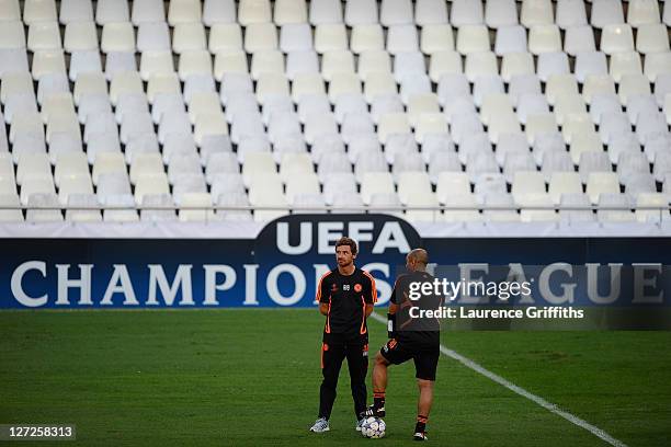 Chelsea manager Andre Villas Boas and assistant coach Roberto Di Matteo speak during a training session ahead of the UEFA Champions League Group E...