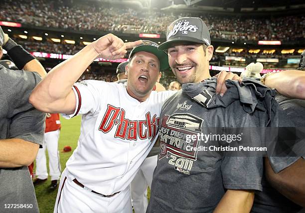 Sean Burroughs and Xavier Nady of the Arizona Diamondbacks celebrate after defeating the San Francisco Giants and clinching the National League West...
