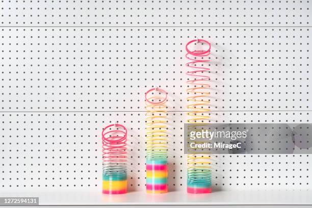abstract graph made up of coil toys - metal coil toy stockfoto's en -beelden